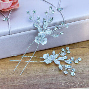 Silver Hair Pins. Timeless silver wedding flower hair accessory featuring delicate rhinestones, beads, and alloy flowers and leaves. Graceful and sophisticated addition to bridal hairstyles.